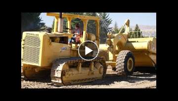 Caterpillar D8H Crawler Tractor Operating with a Cat 463 Towed Scraper in Wanaka