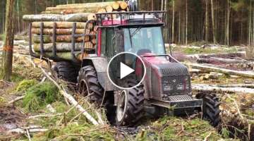 Valtra A93 forestry tractor with big, fully loaded trailer